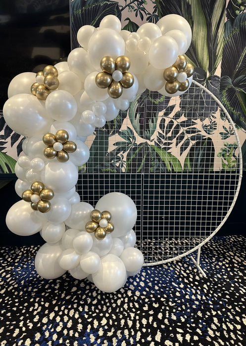 White Balloon Garland + Pops Of Gold Shaped Flowers